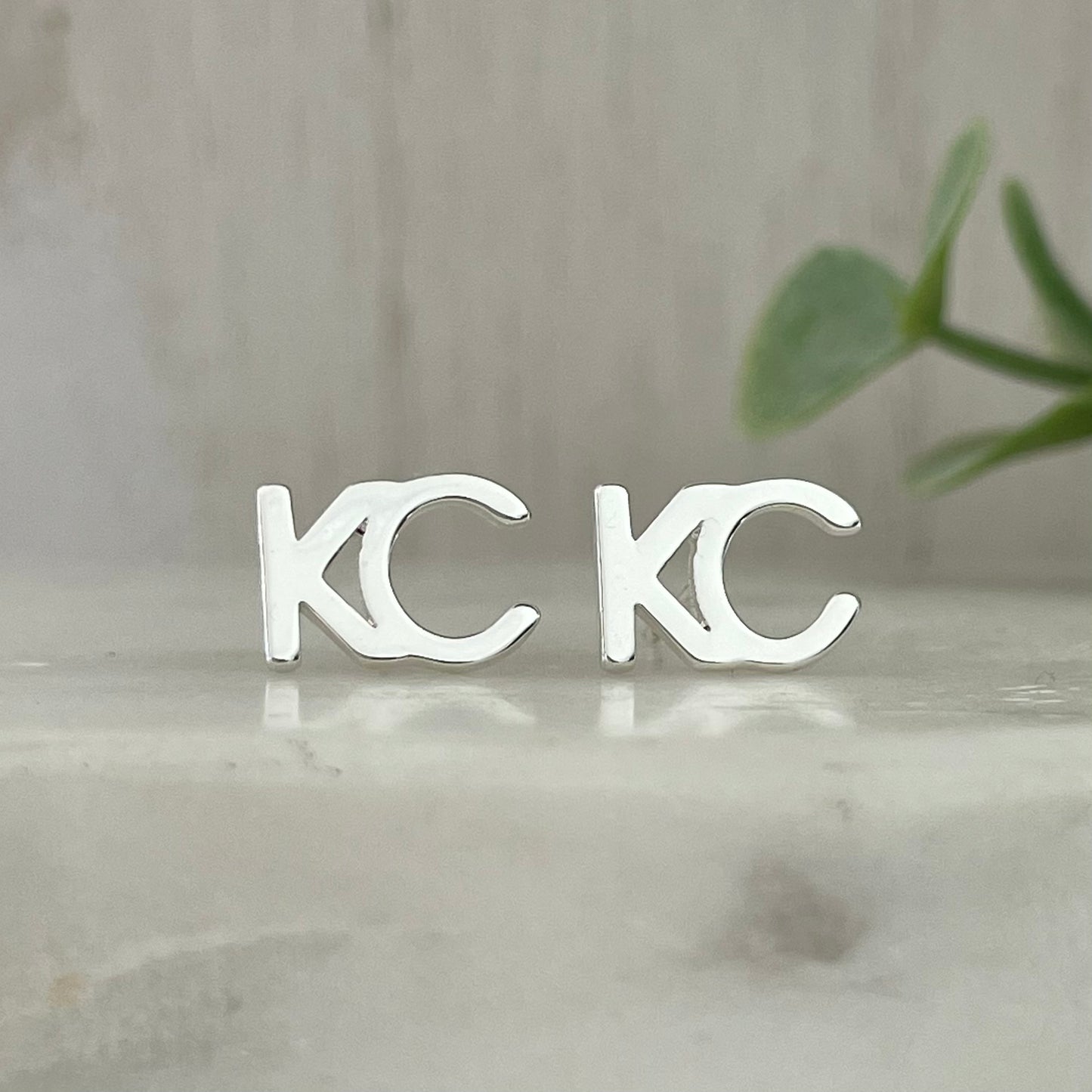 KC stud earrings silver plated This beautiful KC earrings will show your love for your hometown everywhere you go. The silver color is perfect for any outfit, day or night. Layer it with a KC necklace or wear it alone, either way you'll be sure to turn heads.