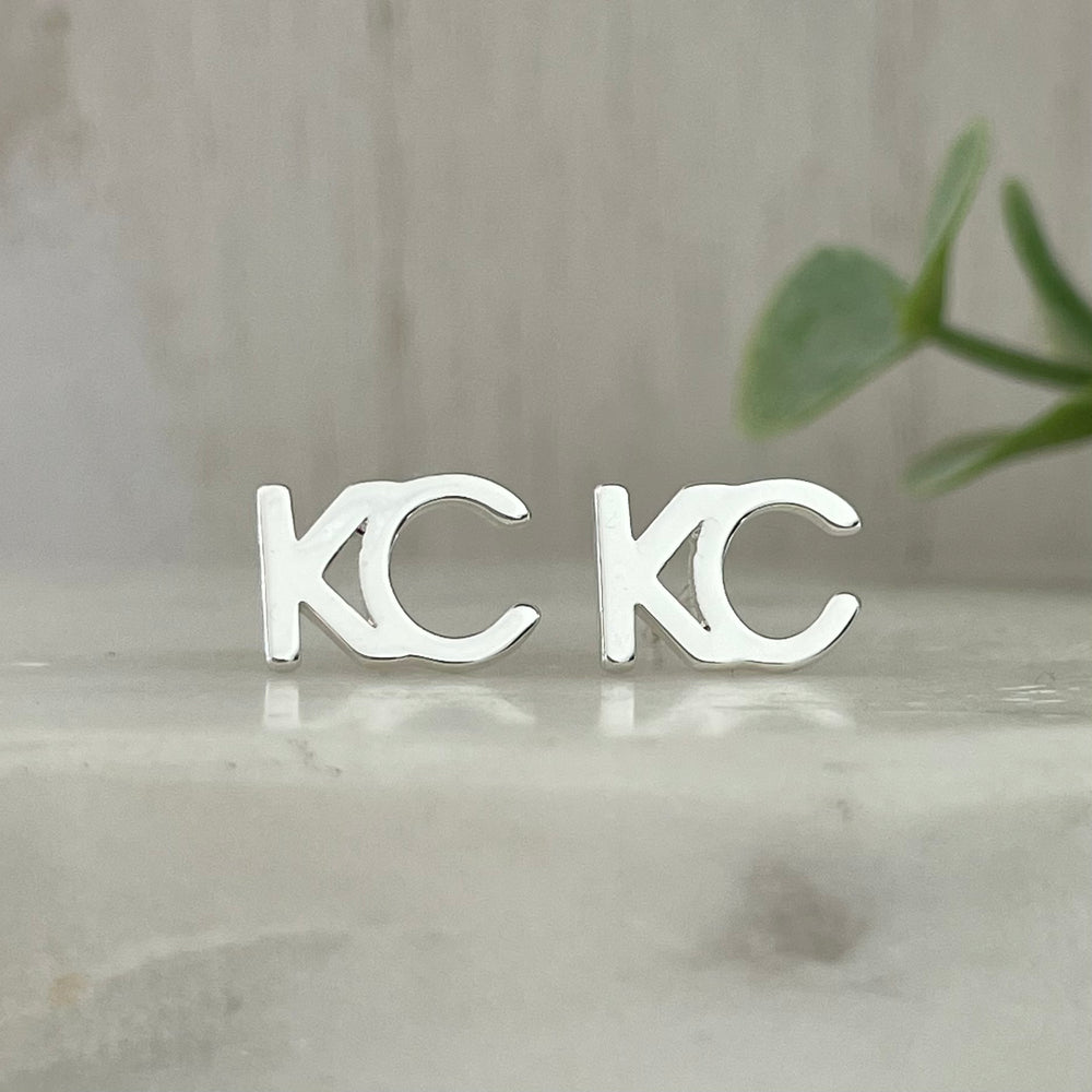 KC stud earrings silver plated This beautiful KC earrings will show your love for your hometown everywhere you go. The silver color is perfect for any outfit, day or night. Layer it with a KC necklace or wear it alone, either way you'll be sure to turn heads. 