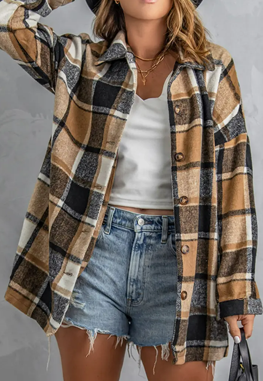The perfect addition to your cool weather wardrobe. A stylish blend of plaid and flannel, this shacket is perfect for a day out in the cool weather. With a laid-back and comfortable fit, it's easy to take from day to night. This shacket will keep you warm all autumn long.