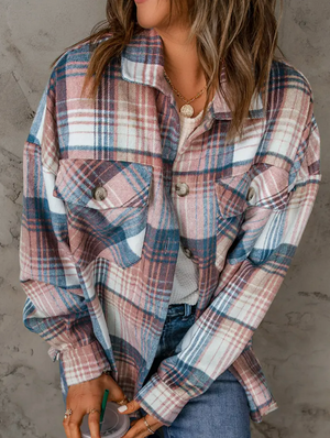 Stay stylish all day and into the night with this pink plaid flannel button up top. The soft and lightweight fabric makes this top a must-have for any cool weather outfit. The pink and white plaid pattern is classic and timeless, and the versatile style can be dressed up or down. Whether you're grabbing a cup of coffee or going out on the town, this top will keep you looking chic.