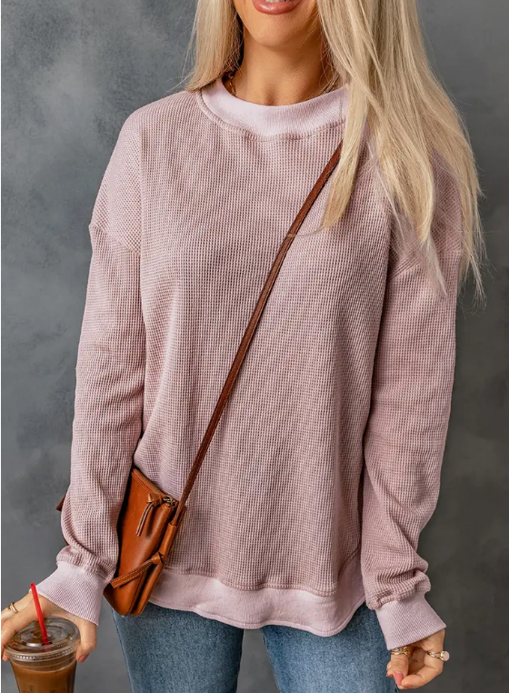 A comfy and chic top for any day of the week. Chic and trendy, this ribbed crew neck top is perfect for giving your everyday look a boost. The soft pink or cool gray color is perfect for adding a feminine touch, and the waffle fabric makes it super soft and cozy. Whether you're running errands or meeting up with friends, this top is the perfect companion. Add it to your wardrobe and wear it with everything from jeans to skirts.