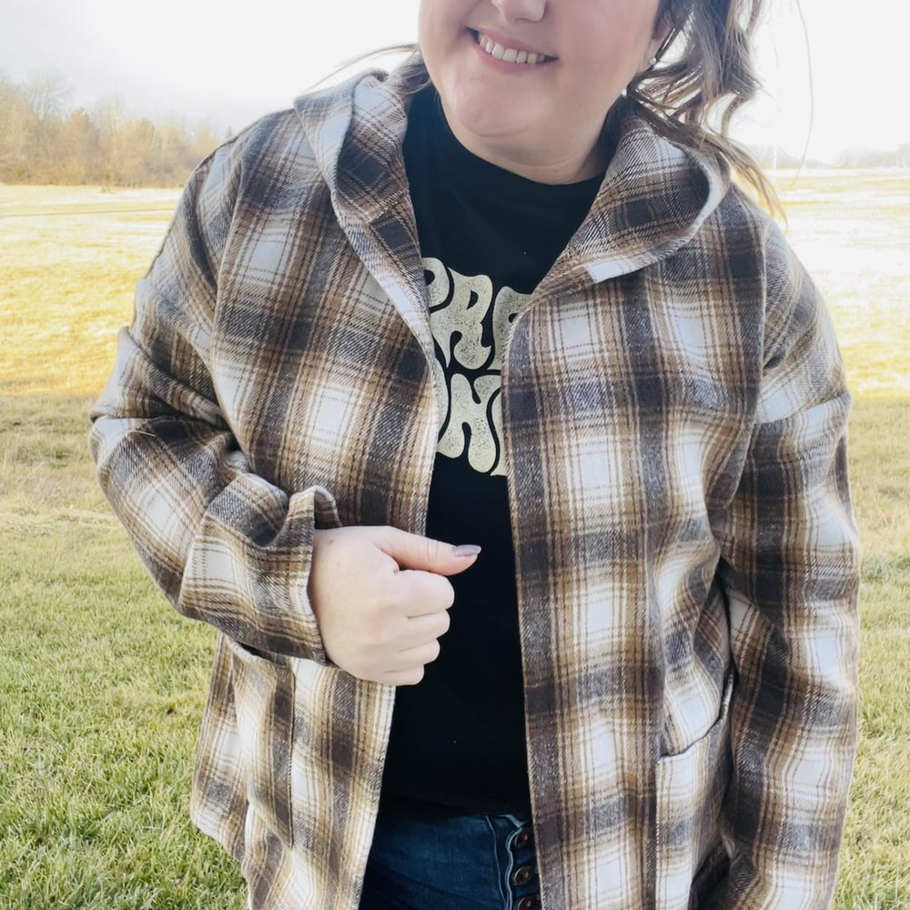 
                  
                    Looking for the perfect piece to keep you warm this season? Check out our Plaid Hooded Jacket! This cozy jacket is perfect for layering and will keep you comfortable all day long. The hood is great for chilly days or when you just want to add a little extra warmth. The brown plaid print is perfect for fall and the jacket is sure to become your new go-to piece.  Details Brown Plaid Lightweight Hooded Front Pockets Great for layering
                  
                