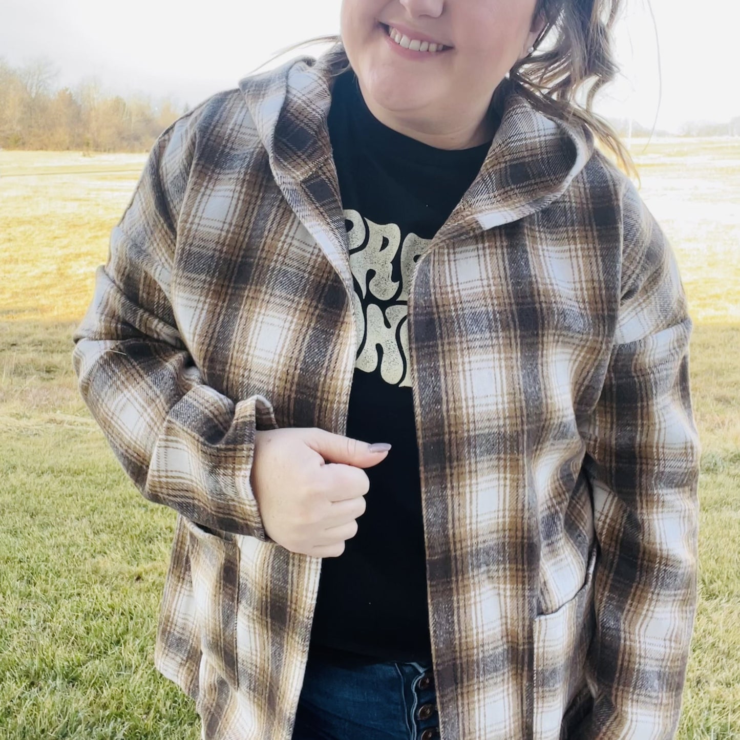 Looking for the perfect piece to keep you warm this season? Check out our Plaid Hooded Jacket! This cozy jacket is perfect for layering and will keep you comfortable all day long. The hood is great for chilly days or when you just want to add a little extra warmth. The brown plaid print is perfect for fall and the jacket is sure to become your new go-to piece.  Details Brown Plaid Lightweight Hooded Front Pockets Great for layering