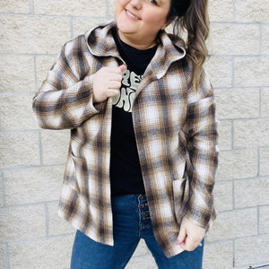 Looking for the perfect piece to keep you warm this season? Check out our Plaid Hooded Jacket! This cozy jacket is perfect for layering and will keep you comfortable all day long. The hood is great for chilly days or when you just want to add a little extra warmth. The brown plaid print is perfect for fall and the jacket is sure to become your new go-to piece.  Details Brown Plaid Lightweight Hooded Front Pockets Great for layering