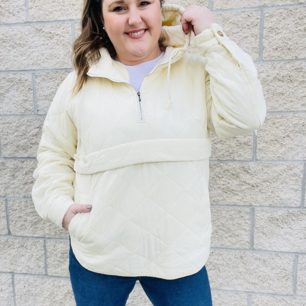 Add a little edge to your style with this quilted hoodie. Elevate your style game with this trendy quilted hoodie. With an ivory color and a unique quilted pattern, this piece is perfect for those colder days. With a relaxed and comfortable fit, this hoodie is a must-have in your wardrobe.  Details Quilted 3/4 Zip Up Pullover Pockets Washed Look