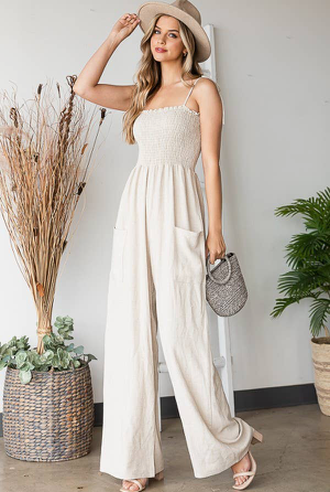 This solid linen jumpsuit is designed for a long-lasting and comfortable loose fit. Featuring an elasticated pleat at the bust, the jumpsuit offers a maximum range of motion and breathability. The linen fabric is lightweight and durable, making it a perfect option for everyday wear.