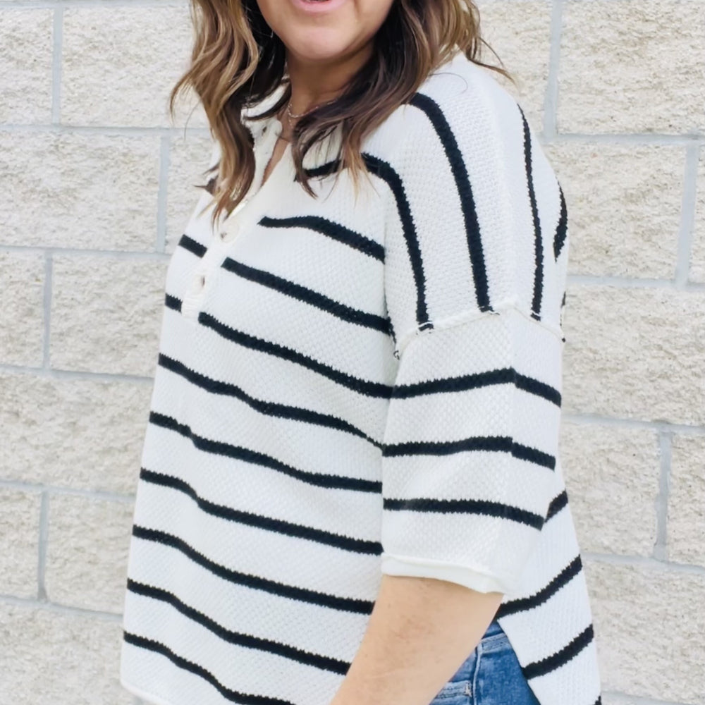 
                  
                    You'll love the way you look in this striped knit top! With an easy transitional sweater design, this top is perfect for those in-between seasons. Dolman sleeves and a loose fit make it a top you'll love to wear all day long. Whether you're dressing it up or keeping it casual, this top is a must-have in your wardrobe.  Details Dolman Sleeves Loose Fit Black and White 60% Cotton 40% Acrylic
                  
                