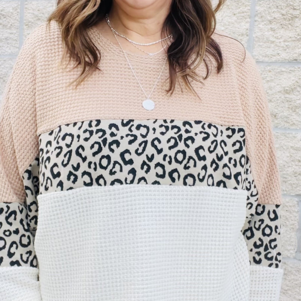 Be a trendsetter this winter in our Waffle Color Block Leopard Top. With a trendy leopard print and a comfortable waffle fabric, this top is perfect for a winter day out. With long sleeves and a stylish color block, this top will keep you warm and looking chic. Pair this top with jeans and a cardigan for a winter day look that will keep you comfortable and stylish.  Details Waffle Fabric Leopard Print Color Block Loose Fit Long Sleeves
