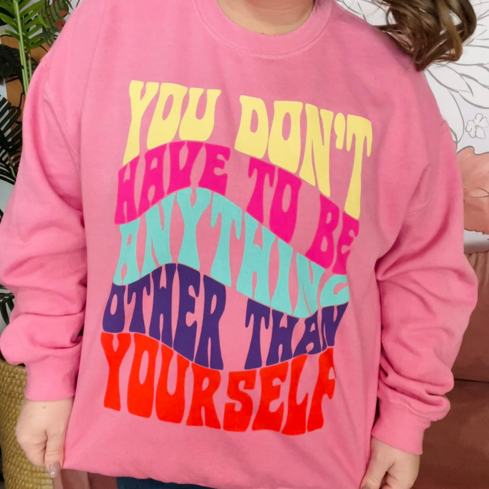 Long sleeve garment-dyed crewneck "you don't have to be anything other than yourself" graphic oversized sweatshirt.   Detalis Pink Oversized Crewneck